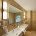 Landhaus Zu den Rothen Forellen in Ilsenburg bathroom with double sink, mirror, and bathtub