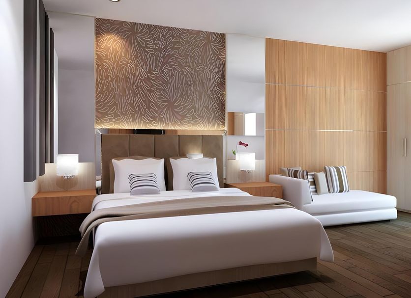 Neotel Hotel City Centre in Tanjung Redeb, modern guest room with king bed and chaise lounge