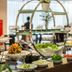 Super Candle Hotel Hanoi buffet table with fresh salads and plated dishes in dining area