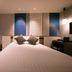 Hotel Jal City Nagasaki room with twin bed, window view, and seating area in Nagasaki