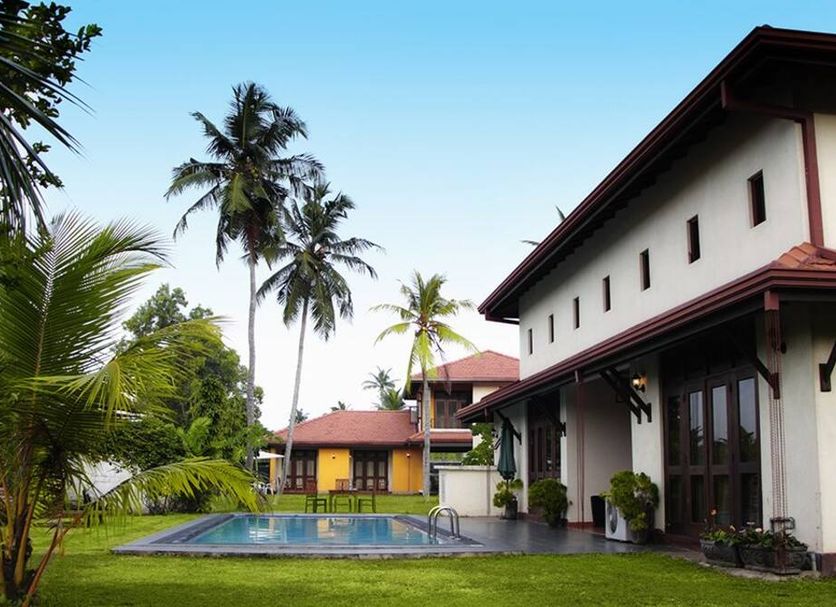 Airport Villa in Katunayake with outdoor pool and tropical garden beside guest villas