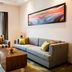 Oakwood Residence Kapil Hyderabad living room with sofa, armchair and city view window in Hyderabad