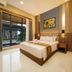 Griya Persada Convention Hotel & Resort Kaliurang guest room with king bed and balcony view in Pakem
