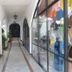 Hotel Casa Vieja in Puerto Escondido, covered arched walkway with glass shopfronts
