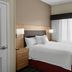 Towneplace Suites By Marriott Danville guest room with king bed and window with sheer curtains
