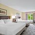 Country Inn & Suites by Radisson Princeton, WV guest room with two beds and window view in Princeton