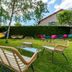 Deltour Hotel Le Puy En Velay garden with hammock, patio seating and lawn in Le-Puy-en-Velay