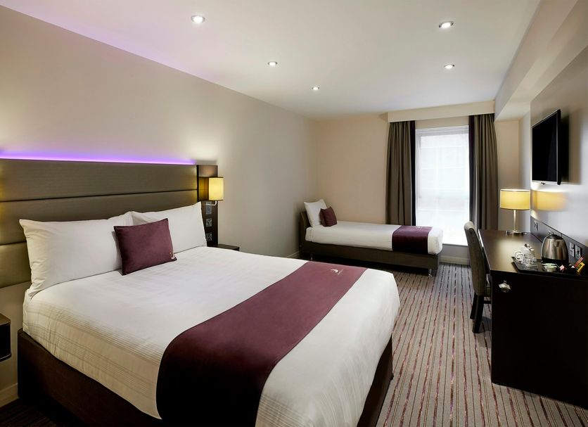 Premier Inn London Gatwick South in Crawley room with king bed, single bed, desk and window
