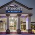 Baymont by Wyndham Port Arthur/Groves Area hotel entrance with columns and lit porte cochere in Port Arthur