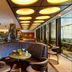 The Chancery Hotel Dublin bar and lounge with curved booth seating, glowing ceiling lights, and floor-to-ceiling windows