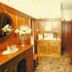 Murrayfield Park Guest House in Edinburgh lobby with wood paneling, cabinet, and patterned carpet