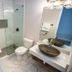 Doolan's Shore Club in Spring Lake Heights bathroom with glass shower and vessel sink