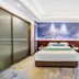 Anhui Construction New Era Hotel Bengbu guest room with king bed, sofa, and large window