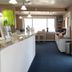 Shoreline Island Resort in Madeira Beach lobby with front desk, brochure table, and ocean-view window seating