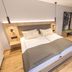 Landhaus Lauble in Hornberg guest room with double bed, wood floors and open wardrobe