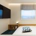 Nube Hotel & Spa Seoul Jongno guest room with bed, window, wall-mounted TV and bedside lamp in Seoul