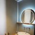 Zandpaviljoen Pier 7 bathroom vanity in Vlissingen with round mirror and vessel sink