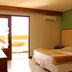 Garden Hotel in Campina Grande guest room with twin beds and balcony doors to outdoor view
