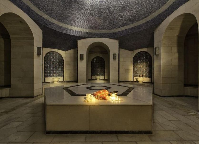 Adalya Art Side in Side: ornate indoor spa lounge with arched alcoves and a central candlelit feature