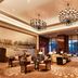 The Westin Wuhan Wuchang lobby with chandeliers, seating area, and floor-to-ceiling windows