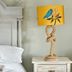 The Martlet Inn, Wellington: white bed with ornate headboard and bird-patterned yellow bedside lamp
