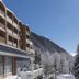 Hotel And Spa Falkensteinerhof in Rio di Pusteria with snowy mountain and pine views from the balcony