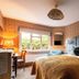 Bel and The Dragon-Cookham, Maidenhead: patterned guest room with king bed, desk, window seat and garden view