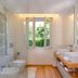 Resort Miramonti, Forte dei Marmi: bright modern bathroom with soaking tub, bidet, and garden-view window