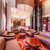 Grand Metropark Guofeng Hotel Tangshan lobby lounge with leather seating, red carpet and chandeliers in Tangshan