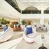 Nova M Olaya Hotel Edge By Rotana in Riyadh lobby with white lounge chairs, marble tables and airy atrium