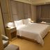 Ji Hotel Shenzhen Shennan Avenue Huaqiang guest room with king bed and seating nook in Shenzhen