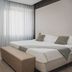 The Regent Boutique Hotel & Spa in San Marino guest room with bed, desk, bench and sheer curtains