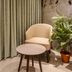 Hotel Corporate Navi Mumbai room with chair, round table, curtains and potted plant