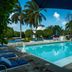 Villablanca Garden Beach Hotel in Cozumel with a tropical outdoor pool and palm trees