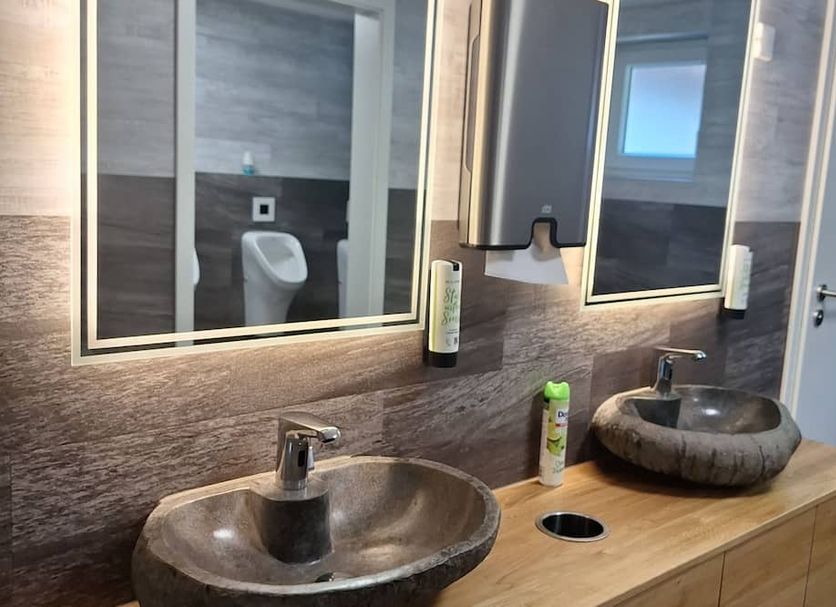 Grüner Hof in Zell am Harmersbach bathroom with two stone vessel sinks and mirrors