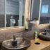 Grüner Hof in Zell am Harmersbach bathroom with two stone vessel sinks and mirrors