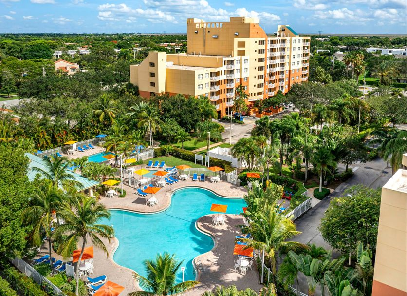 Vacation Village at Bonaventure, Weston: lagoon-style pool surrounded by palm trees and resort buildings