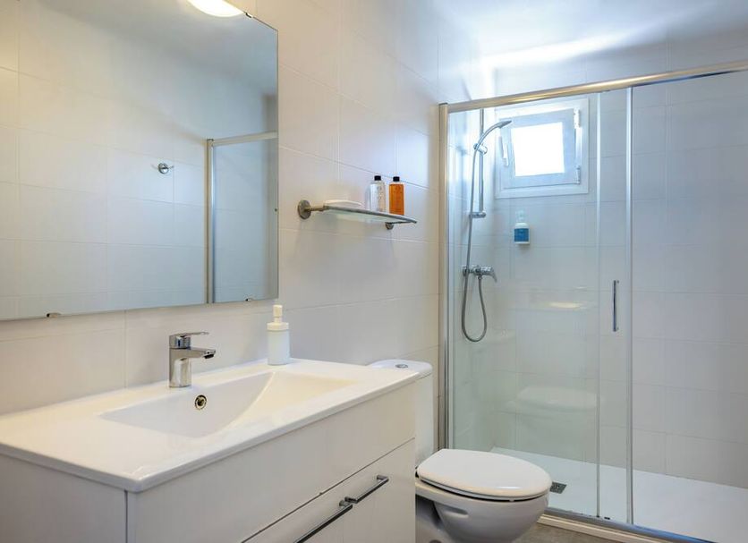 Hoposa Panorama, Port de Pollença: modern bathroom with shower, sink, mirror and toilet