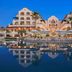 Hacienda del Mar Los Cabos, An Autograph Collection Resort in Cabo San Lucas with illuminated pools and oceanfront reflection