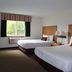 Americas Best Value Inn Annandale guest room with two beds and a window view