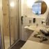 Hotel Engel in Kappel-Grafenhausen bathroom with glass shower, sink, mirror and tiled walls