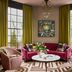 Zelda Dearest Asheville lounge with pink seating, marble coffee table, and tall windows