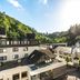 Hotel Zugbrücke Grenzau in Hohr Grenzhausen with Alpine-style buildings and hillside setting
