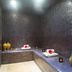 Hôtel & Spa du Domaine des Thômeaux, Mosnes spa room with mosaic walls, loungers and decorative vases