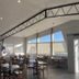 Sunglow Motel in Bicknell dining room with large windows and wooden tables