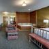 Stoney Creek Hotel Sioux City in Sioux City room with hot tub, seating area and wooden accents