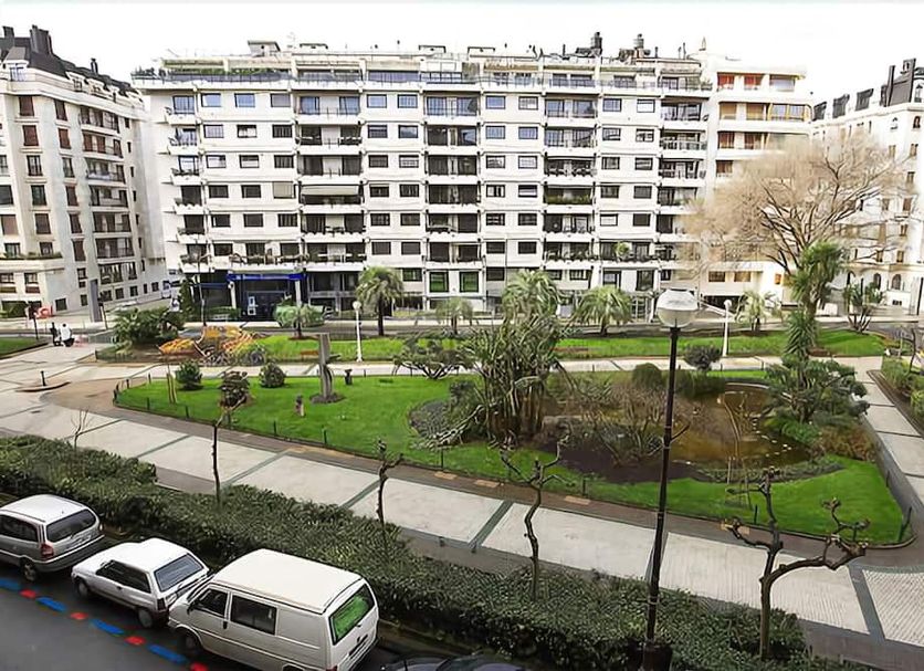 Hotel Zaragoza Plaza in San Sebastian overlooking a landscaped courtyard with walking paths and surrounding apartment buildings