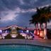 Hard Rock Hotel Vallarta in Nuevo Vallarta: illuminated poolside event setup with palm trees at dusk