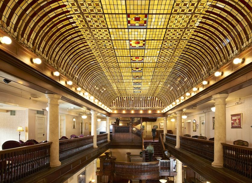 Hotel Boulderado in Boulder, grand historic lobby with ornate arched stained-glass ceiling