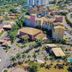 Thermas de Olímpia Resort in Olímpia with resort buildings, palm-lined roads and nearby pools